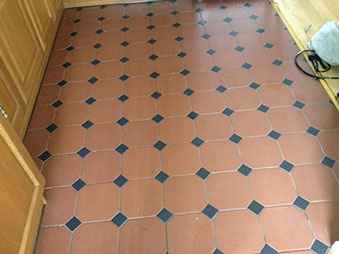 In this picture you can see the quarry tiles are looking worn due to the dirty grout and loss of sealer on the tiles.